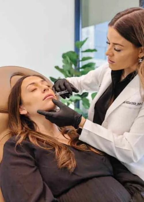 A woman takes dermal fillers